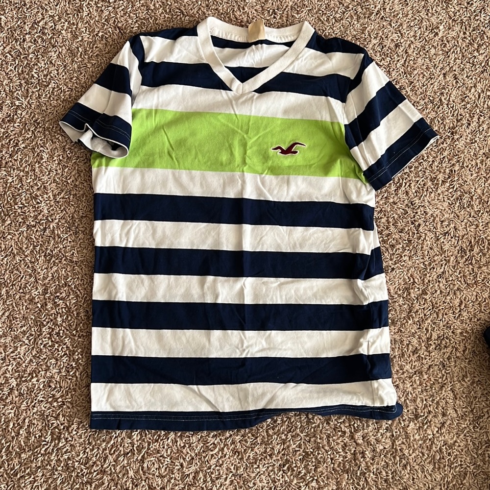 Used medium white blue and green short sleeve shirt. V neck.